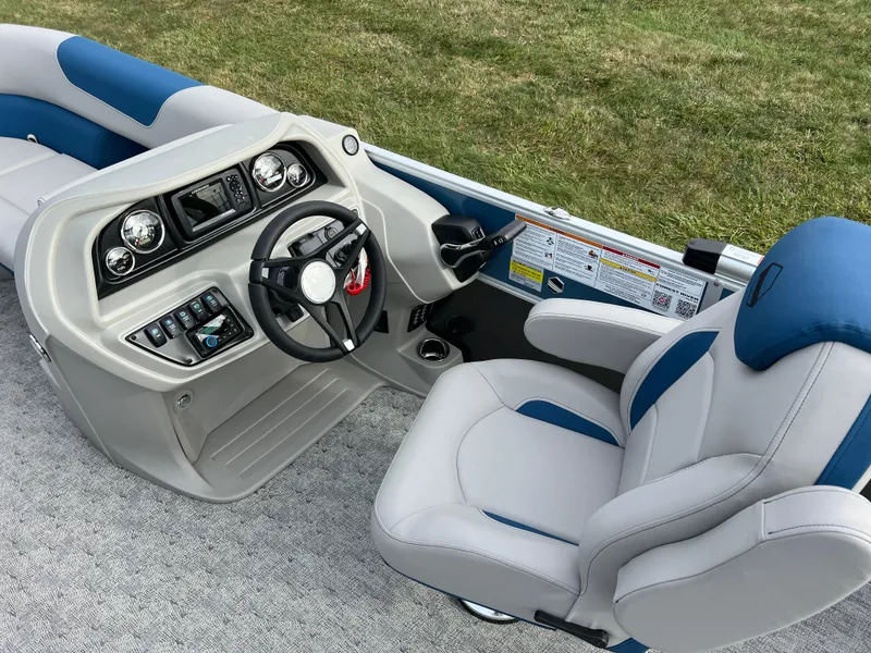 Slide: The Image of 2025 South Bay 222 CR2 LE boat interior with modern dashboard and comfortable seating. - 16