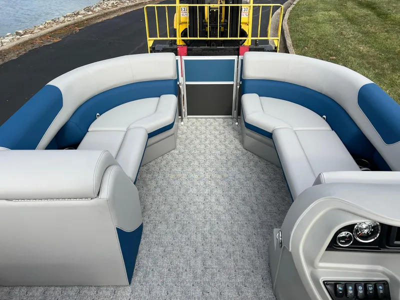 Slide: The Image of 2025 South Bay 222 CR2 LE pontoon boat interior with blue and gray seating. - 20