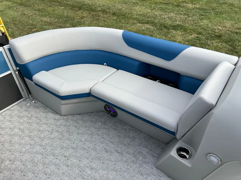 Slide: The Image of 2025 South Bay 222 CR2 LE boat interior with blue and gray seating. - 21