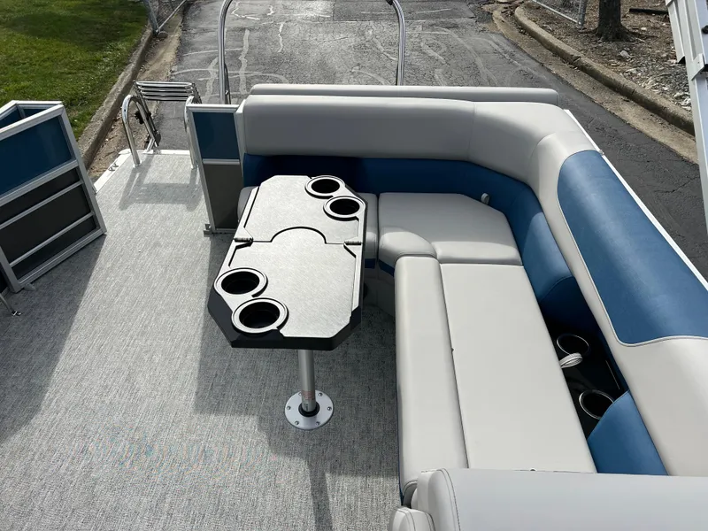 Slide: The Image of 2025 South Bay 222 CR2 LE pontoon boat interior with seating and cupholders. - 23