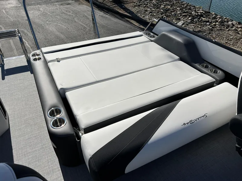 Slide: The Image of 2025 South Bay S 224 UL boat with sleek white seating and cup holders. - 16
