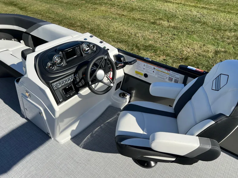 Slide: The Image of 2025 South Bay S 224 UL boat interior with modern steering console and comfortable seating. - 20