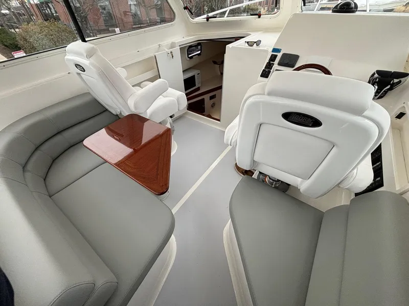 Slide: The Image of Luxurious interior of 2025 NorthCoast 285 Cabin boat with plush seating and modern design. - 16