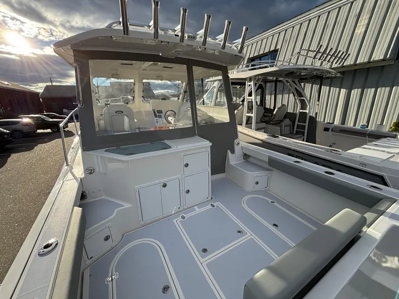 Slide: The Image of 2025 NorthCoast 285 Cabin boat interior with modern design and ample seating. - 8