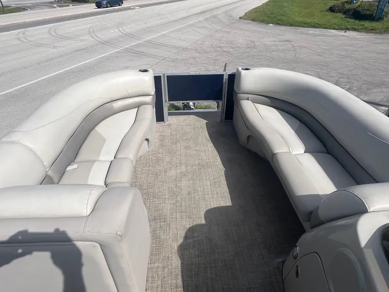 Slide: The Image of 2022 Cypress Cay Seabreeze 232 pontoon boat interior with plush seating. - 2