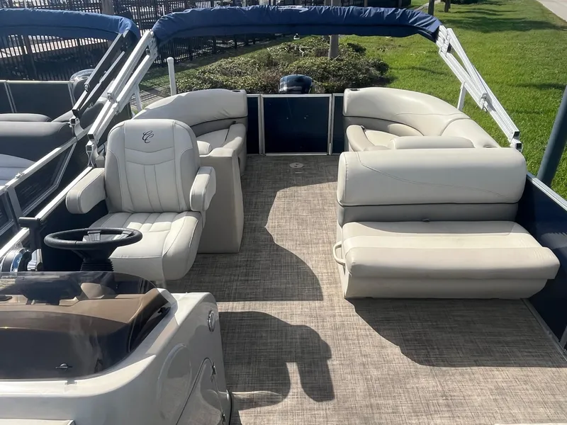 Slide: The Image of 2022 Cypress Cay Seabreeze 232 pontoon boat with spacious seating and modern design. - 6