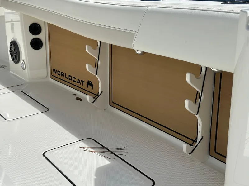 Slide: The Image of 2025 World Cat 260 CC-X boat interior with rod holders and storage compartments. - 10