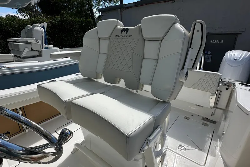 Slide: The Image of 2025 World Cat 260 CC-X boat with luxurious white seating and modern design. - 11