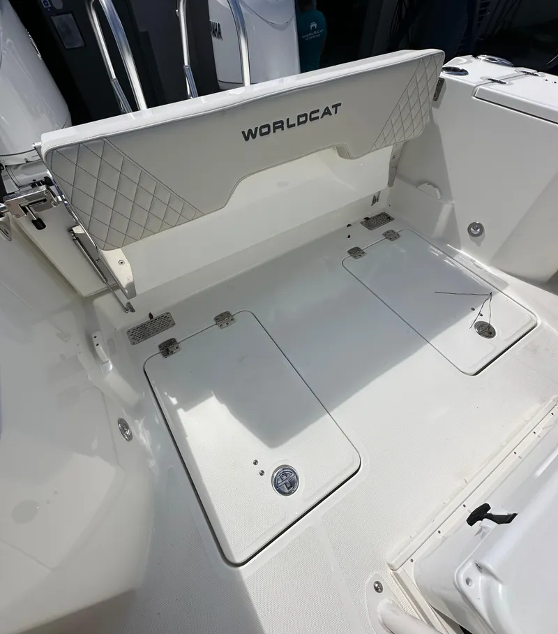 Slide: The Image of 2025 World Cat 260 CC-X boat deck with storage compartments and seating. - 12