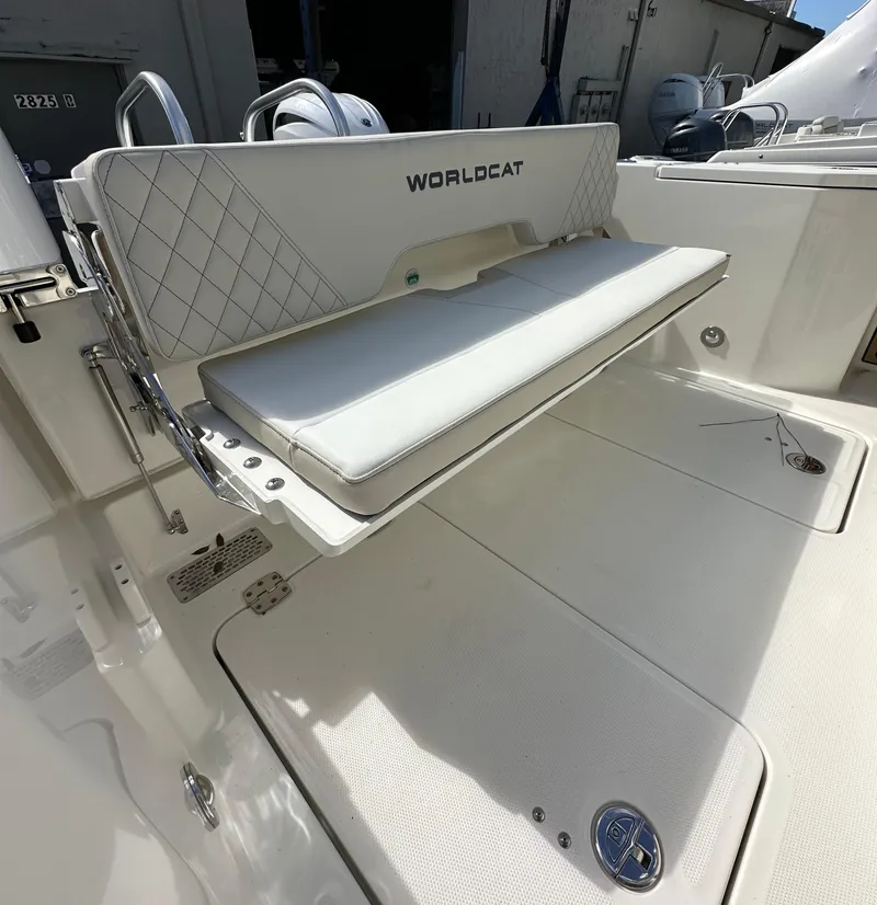 Slide: The Image of 2025 World Cat 260 CC-X boat with foldable seating in white interior. - 13