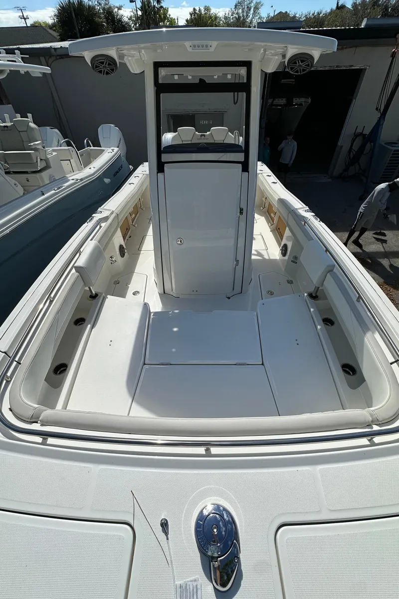 Slide: The Image of 2025 World Cat 260 CC-X boat, spacious deck, modern design, white interior. - 17