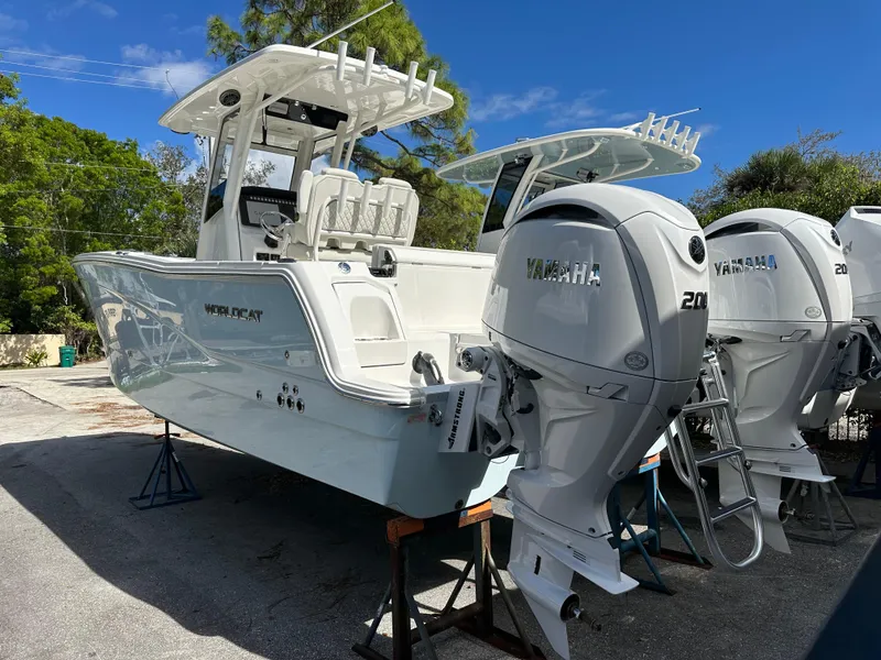 Slide: The Image of 2025 World Cat 260 CC-X boat with Yamaha engines on display outdoors. - 2