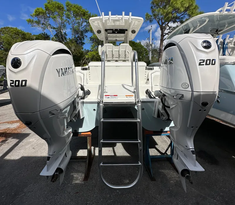 Slide: The Image of 2025 World Cat 260 CC-X boat with dual Yamaha 200 engines, rear view. - 3