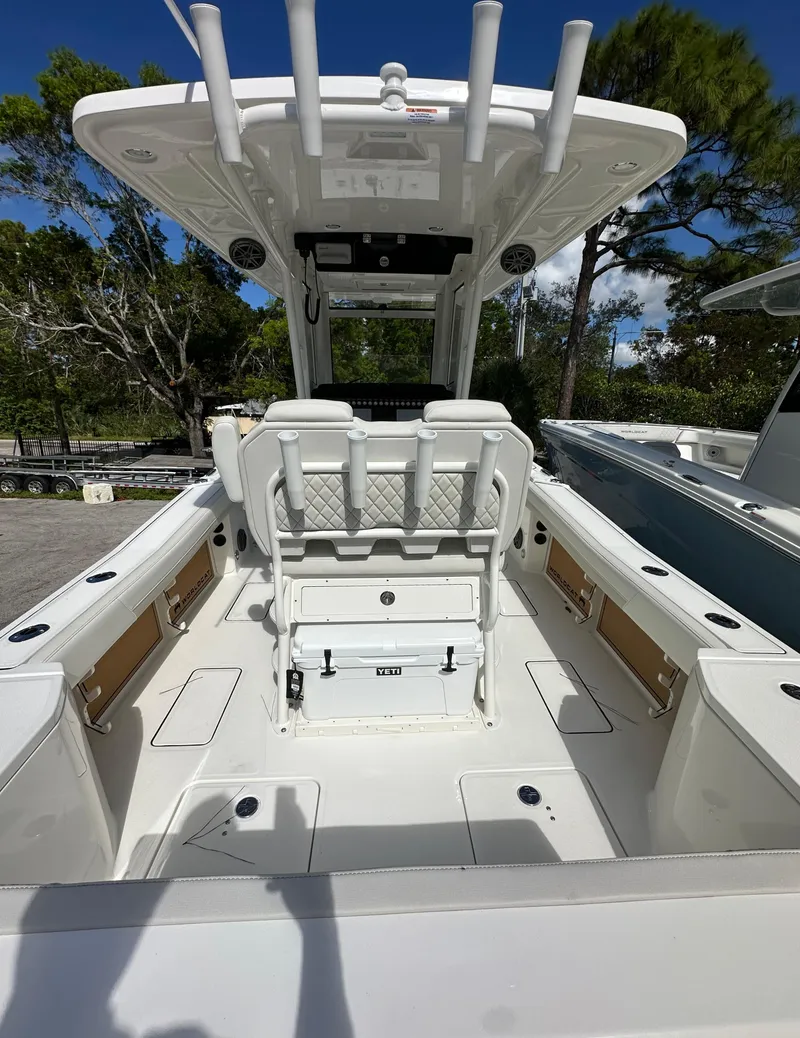 Slide: The Image of 2025 World Cat 260 CC-X boat interior with seating and storage, featuring a sleek design. - 4