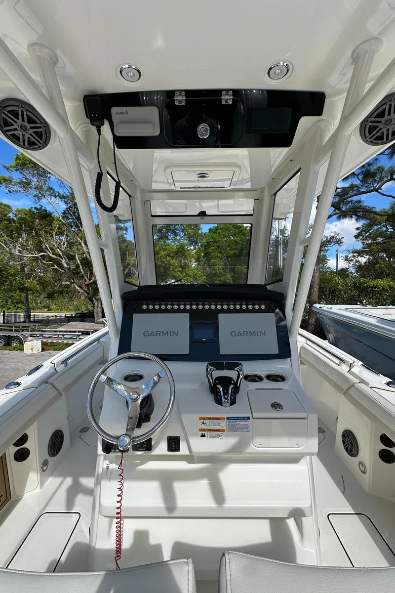 Slide: The Image of 2025 World Cat 260 CC-X boat cockpit with Garmin navigation system. - 5