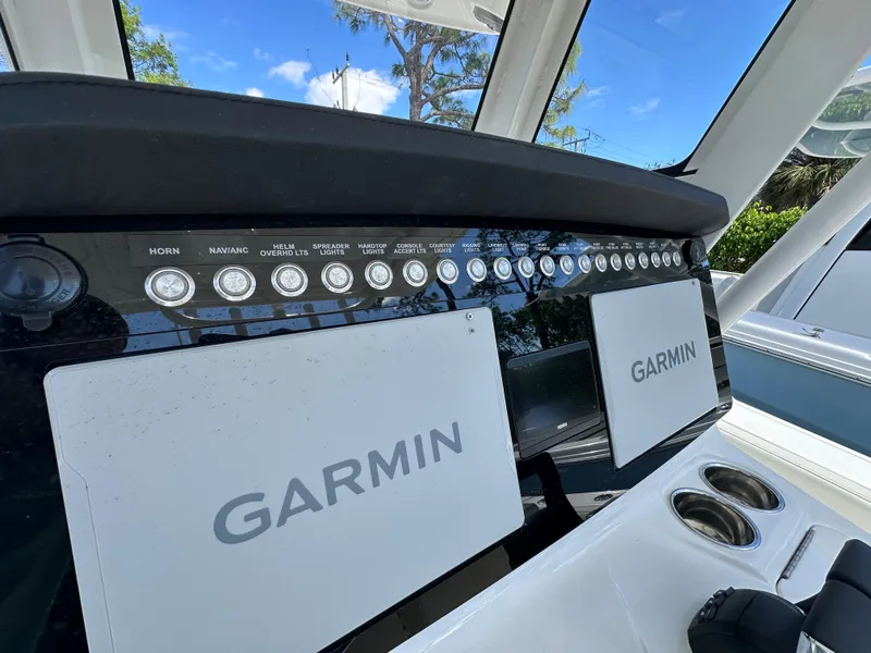 Slide: The Image of 2025 World Cat 260 CC-X dashboard with Garmin navigation displays and control panel. - 9