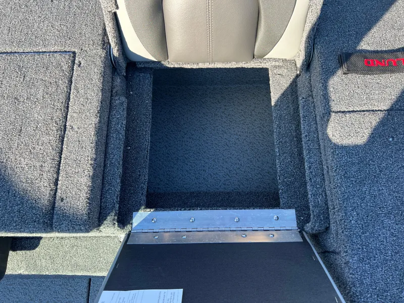 Slide: The Image of 2025 Lund 1775 Impact XS Sport boat interior storage compartment. - 25
