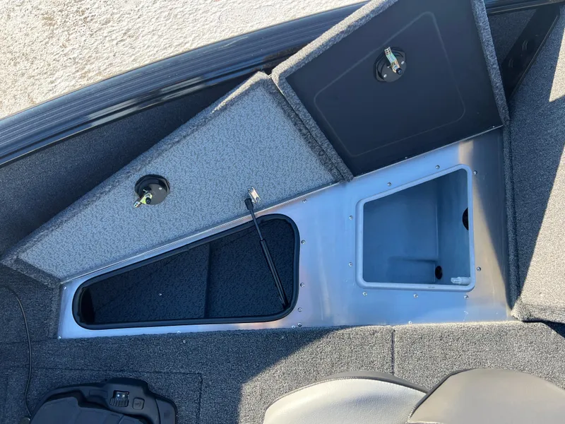 Slide: The Image of 2025 Lund 1775 Impact XS Sport boat storage compartments, open and spacious design. - 9