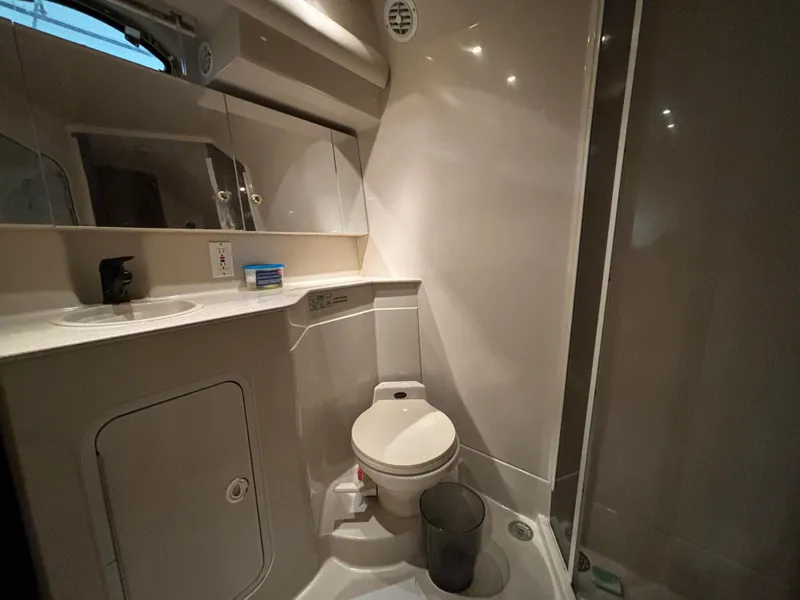 Slide: The Image of 1998 Cruisers Yachts 3870 Esprit bathroom with toilet, sink, and shower. - 18