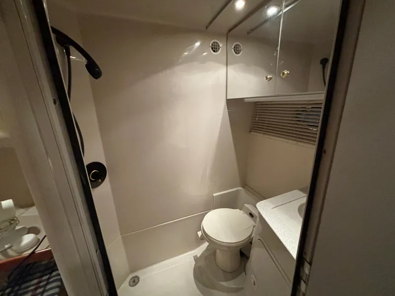 Slide: The Image of Bathroom interior of 1998 Cruisers Yachts 3870 Esprit, featuring toilet and shower. - 20