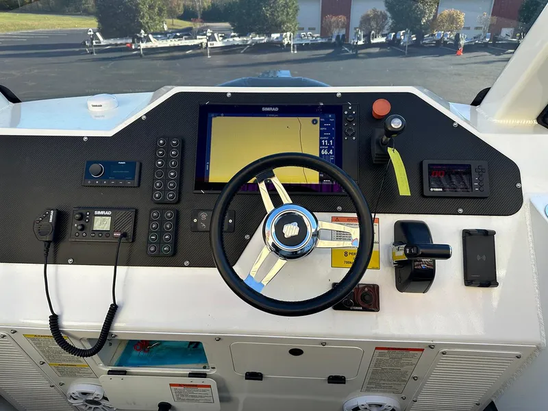 Slide: The Image of Sealegs 7.5 Semi Cabin 2020 dashboard with navigation controls and steering wheel. - 10