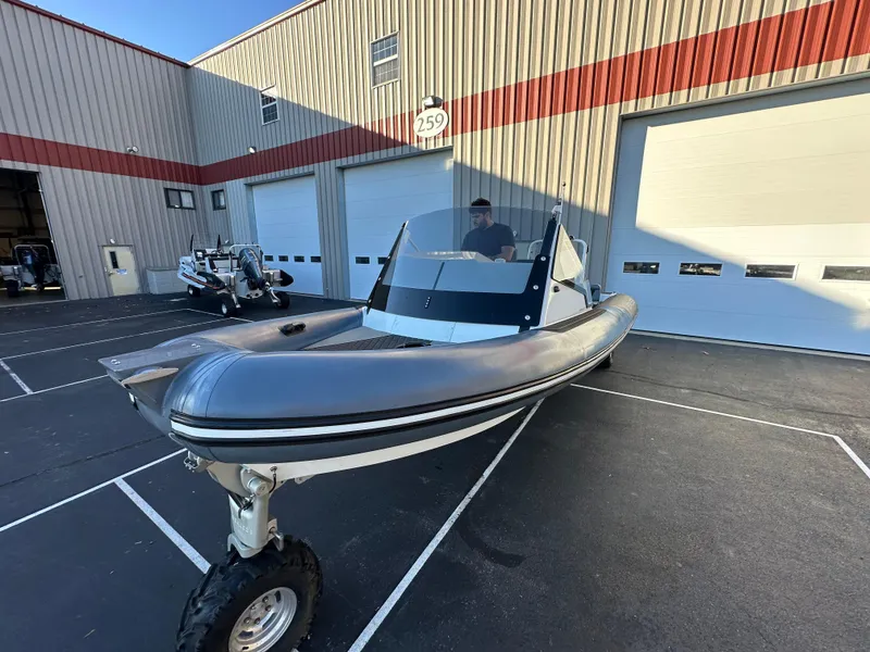 Slide: The Image of 2020 Sealegs 7.5 Semi Cabin boat with amphibious wheels in a parking lot. - 12