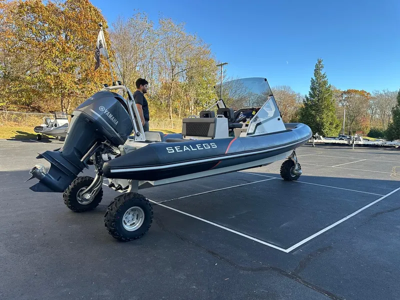 Slide: The Image of 2020 Sealegs 7.5 Semi Cabin boat with Yamaha engine on land. - 6