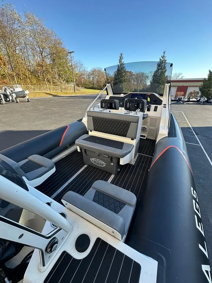 Slide: The Image of 2020 Sealegs 7.5 Semi Cabin boat with seating, parked outdoors. - 7