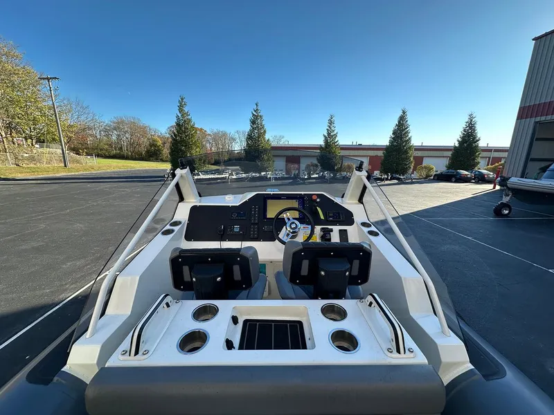 Slide: The Image of 2020 Sealegs 7.5 Semi Cabin boat dashboard with steering wheel and controls. - 9