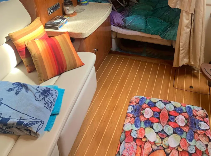 Slide: The Image of Interior of 2005 Regal Commodore 3560 yacht with colorful decor and cozy seating. - 10