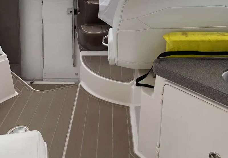 Slide: The Image of Interior of 2005 Regal Commodore 3560 boat with seating and storage. - 13