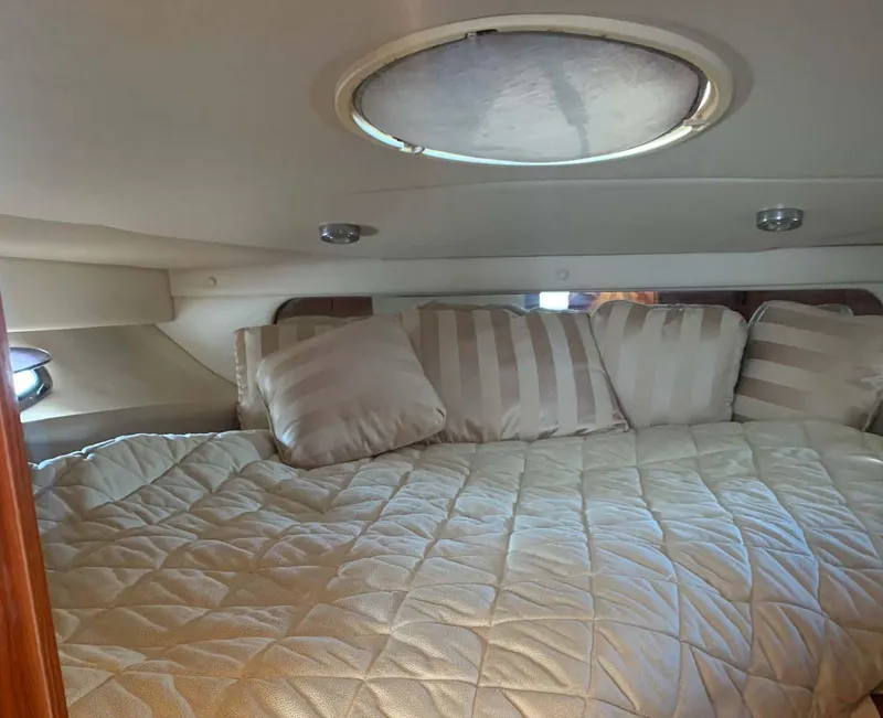 Slide: The Image of Cozy cabin interior of 2005 Regal Commodore 3560 yacht with plush bedding. - 8