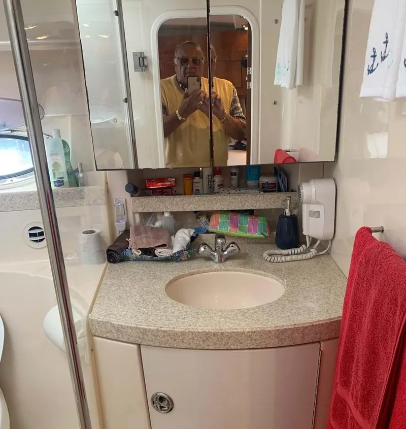 Slide: The Image of Bathroom interior of 2005 Regal Commodore 3560 yacht with mirror and sink. - 9