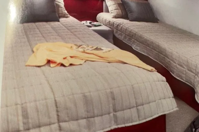 Slide: The Image of Interior cabin of 2008 Sea Ray 48 Sundancer with twin beds and cozy bedding. - 12