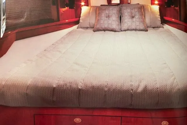 Slide: The Image of Luxurious bedroom interior of 2008 Sea Ray 48 Sundancer yacht with cozy bedding. - 14