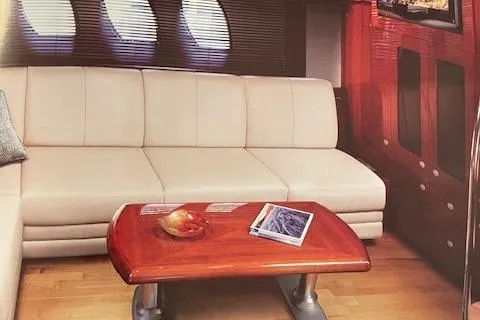 Slide: The Image of Luxurious interior of 2008 Sea Ray 48 Sundancer yacht with beige sofa and wooden table. - 15