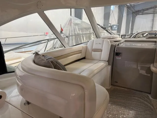 Slide: The Image of 2009 Sea Ray 48 Sundancer interior with elegant white seating and modern design. - 17