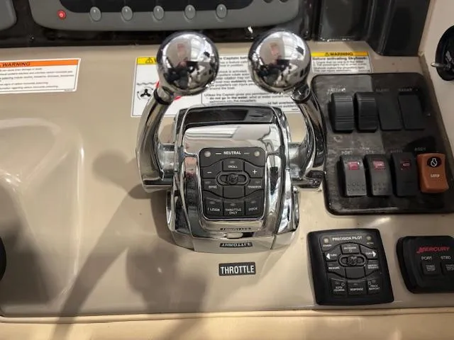 Slide: The Image of Throttle controls on 2009 Sea Ray 48 Sundancer boat dashboard. - 22