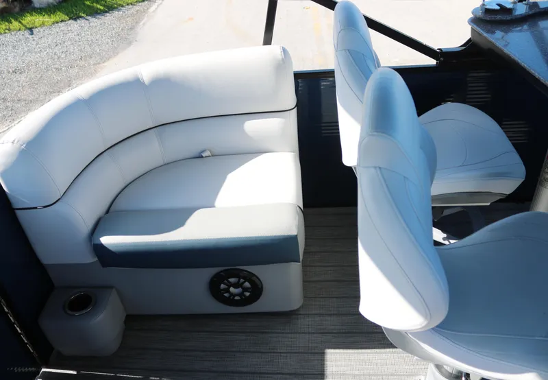 Slide: The Image of Sweetwater 2186 MT 2021 boat interior with white cushioned seating and modern design. - 15