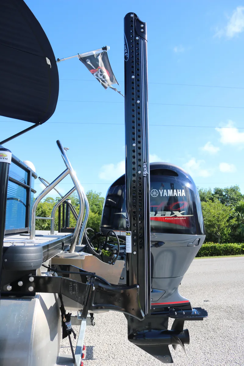 Slide: The Image of Sweetwater 2186 MT 2021 boat with Yamaha outboard motor, docked outdoors. - 6
