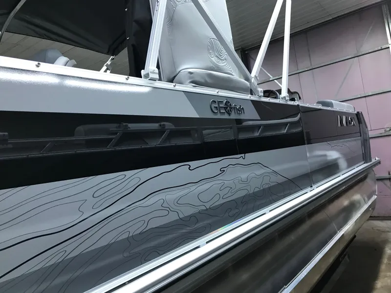 Slide: The Image of 2025 Avalon GEOfish REAR FISH boat with sleek design and modern graphics. - 1