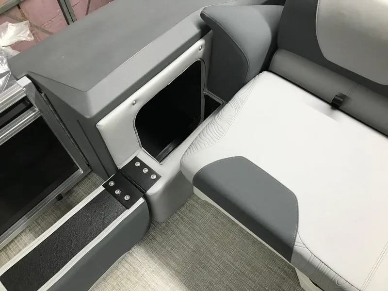 Slide: The Image of Interior of 2025 Avalon GEOfish REAR FISH boat, featuring sleek seating and storage compartment. - 14