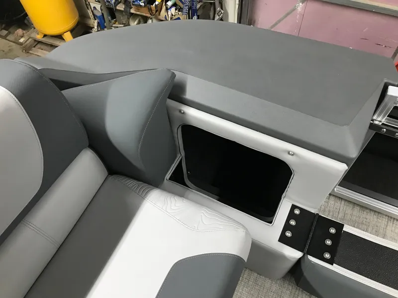 Slide: The Image of Interior of 2025 Avalon GEOfish REAR FISH boat with gray and white seating. - 16