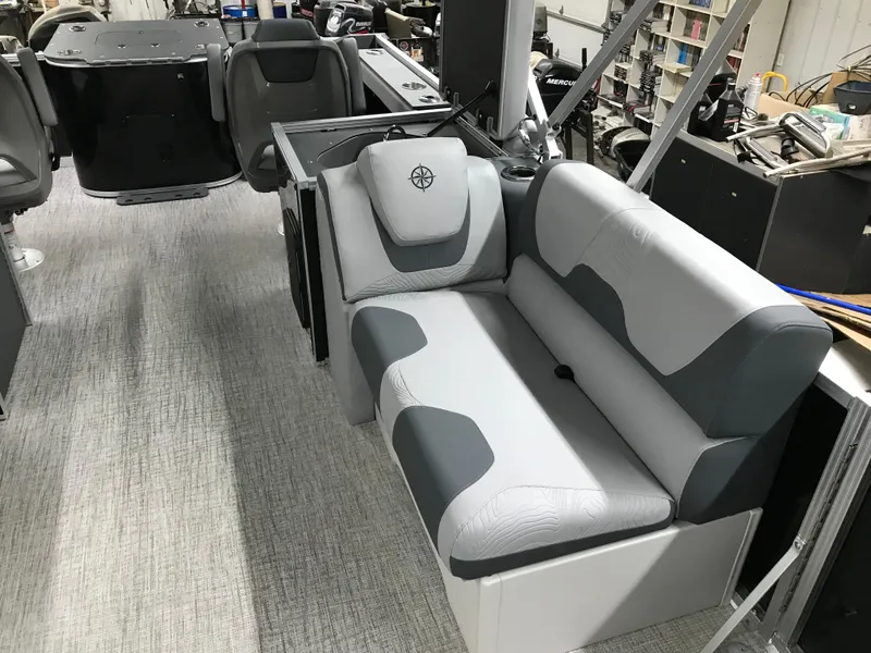 Slide: The Image of 2025 Avalon GEOfish REAR FISH boat interior with gray seating and modern design. - 17