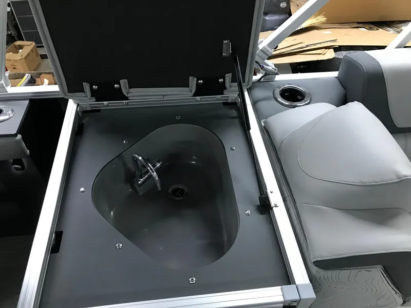 Slide: The Image of 2025 Avalon GEOfish REAR FISH boat interior with open storage compartment and seating. - 18