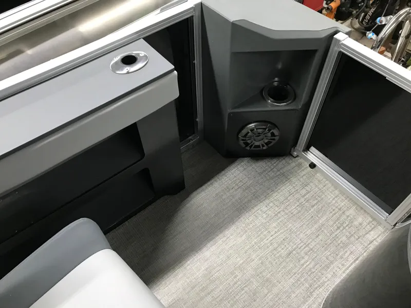 Slide: The Image of Interior of 2025 Avalon GEOfish REAR FISH boat with speaker and cup holder. - 22