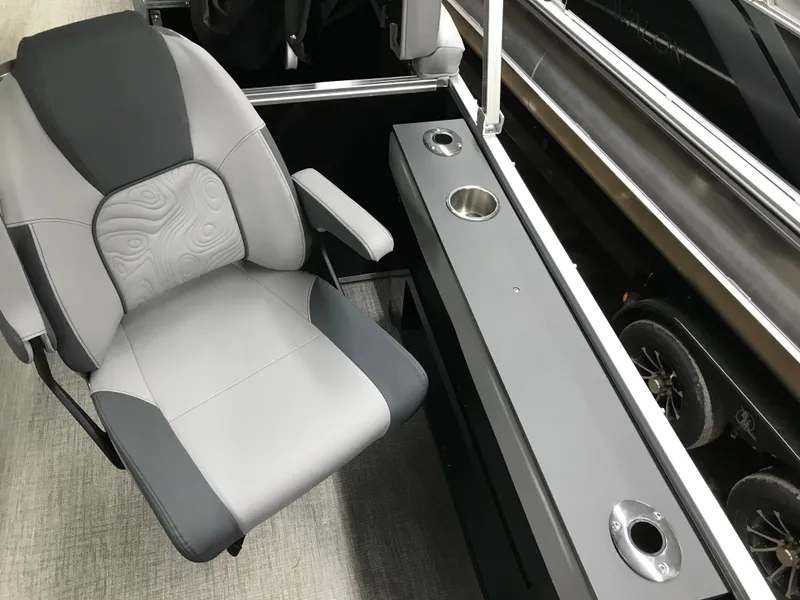 Slide: The Image of 2025 Avalon GEOfish REAR FISH boat interior with gray seating and cup holders. - 23