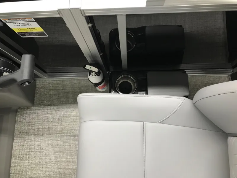 Slide: The Image of Interior of 2025 Avalon GEOfish REAR FISH with gray seating and cup holders. - 34