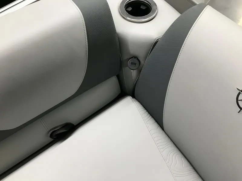 Slide: The Image of Avalon GEOfish REAR FISH 2025 boat seating with cup holder, featuring sleek gray upholstery. - 41