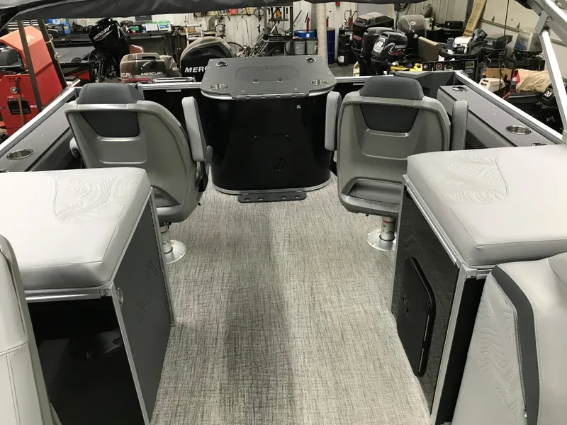 Slide: The Image of 2025 Avalon GEOfish REAR FISH boat interior with gray seating and carpeted flooring. - 42